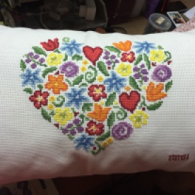 Look at this beautiful cross stitch done by Chelsea! On a pillow some more. Very touched. It's really beautiful.