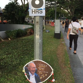 A sign that many Singaporeans would be familiar with. Below, hand-made tribute.