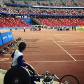 Wheelchair athlete looking on another 400m heat for the same event